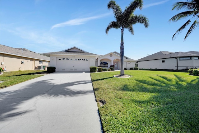 ranch-style house featuring a garage and a front yard