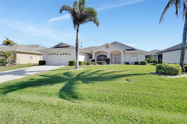 ranch-style house with a garage and a front yard