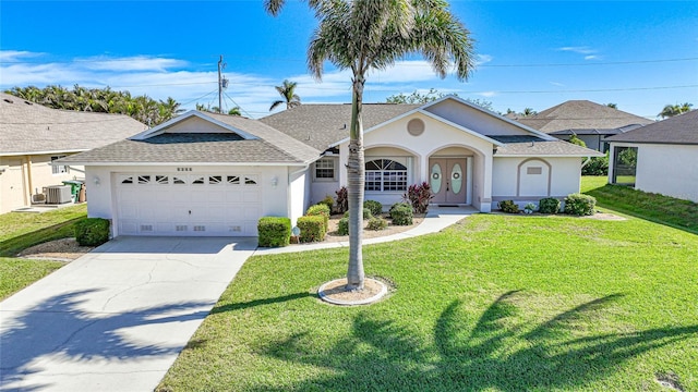 ranch-style home with a garage, central air condition unit, and a front lawn