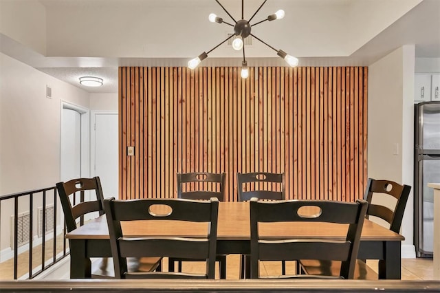 dining room with a notable chandelier