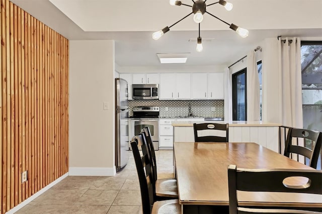 tiled dining room with sink