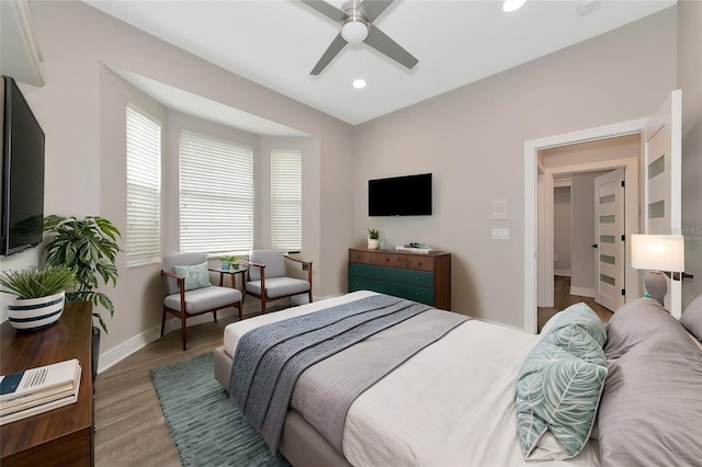 bedroom with hardwood / wood-style flooring and ceiling fan