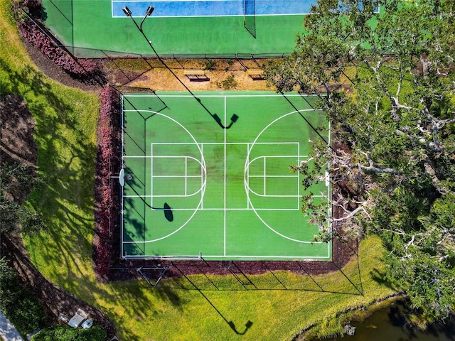 view of sport court featuring a water view