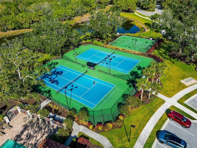 birds eye view of property with a water view