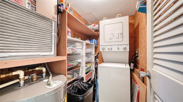 laundry room with stacked washer and dryer, a textured ceiling, and water heater