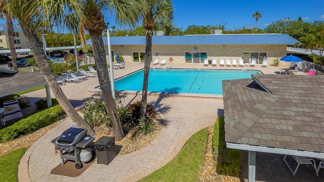 view of swimming pool featuring a patio area