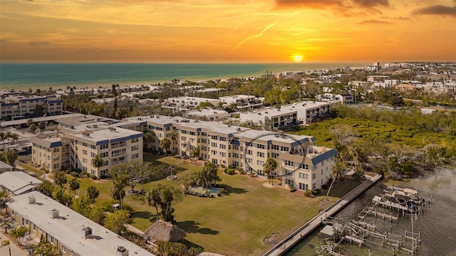 aerial view at dusk with a water view