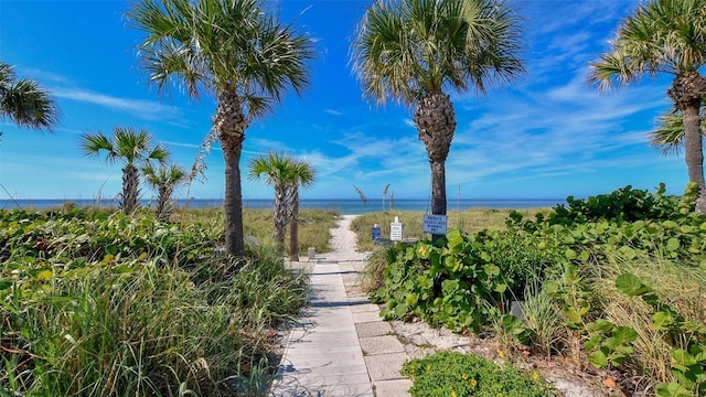 surrounding community featuring a water view