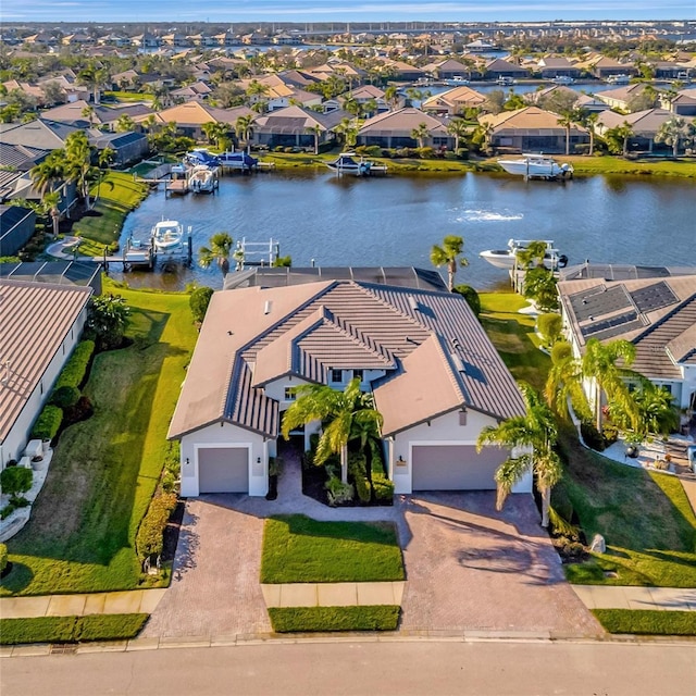 birds eye view of property featuring a water view