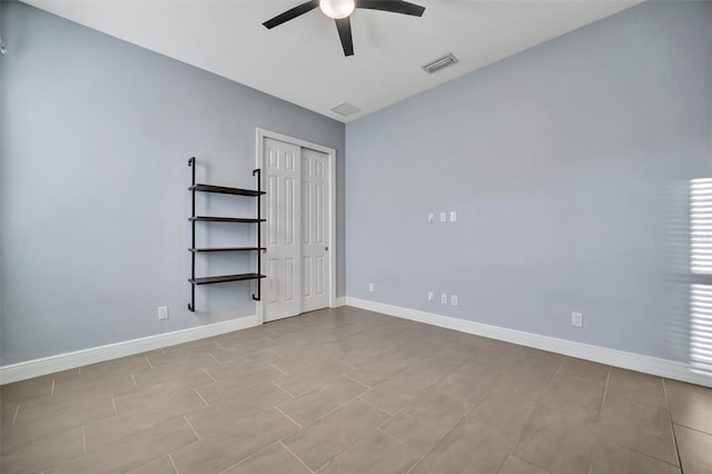 unfurnished room with ceiling fan