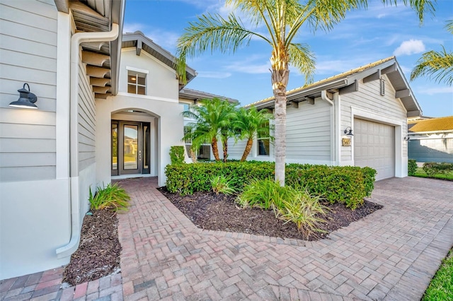 doorway to property featuring a garage