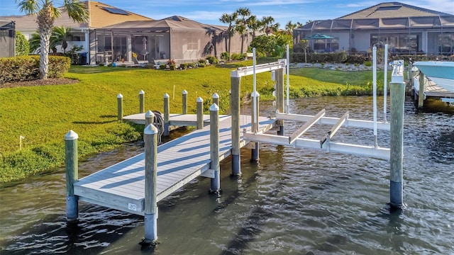 5607 Tidewater Preserve Blvd, Bradenton, FL 34208 - dock area featuring boat lift, a water view, and a lawn