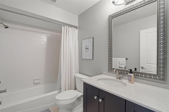 full bathroom with vanity, toilet, shower / tub combo, and a textured ceiling