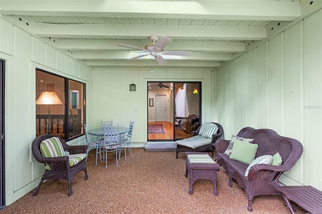 sunroom / solarium with beamed ceiling and ceiling fan