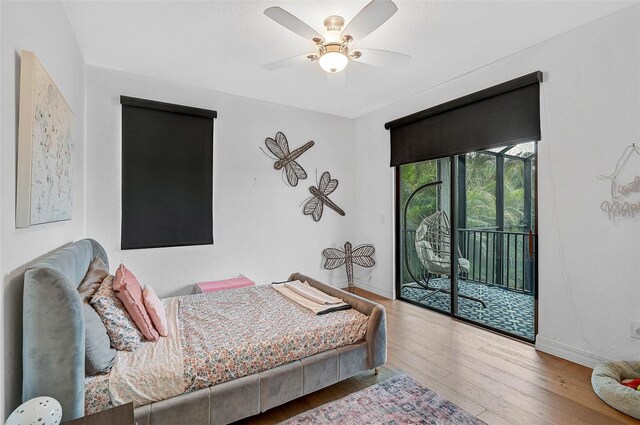 bedroom featuring ceiling fan, access to outside, and wood-type flooring