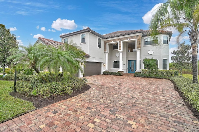 mediterranean / spanish-style house featuring a garage