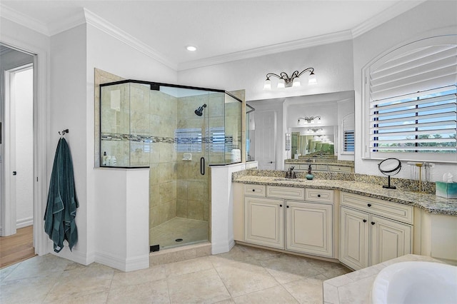 bathroom with ornamental molding, shower with separate bathtub, vanity, and tile patterned floors