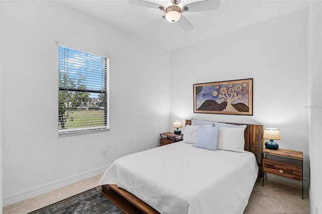 bedroom featuring tile patterned floors and ceiling fan