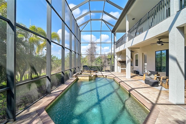 view of swimming pool featuring a lanai, area for grilling, ceiling fan, and a patio area