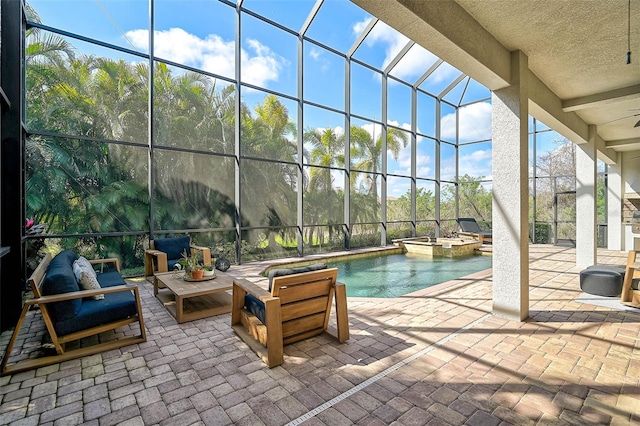 view of patio / terrace with a pool with hot tub and glass enclosure