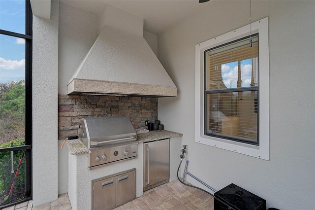 view of patio with grilling area and exterior kitchen