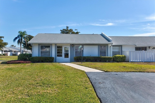 ranch-style house with a front yard