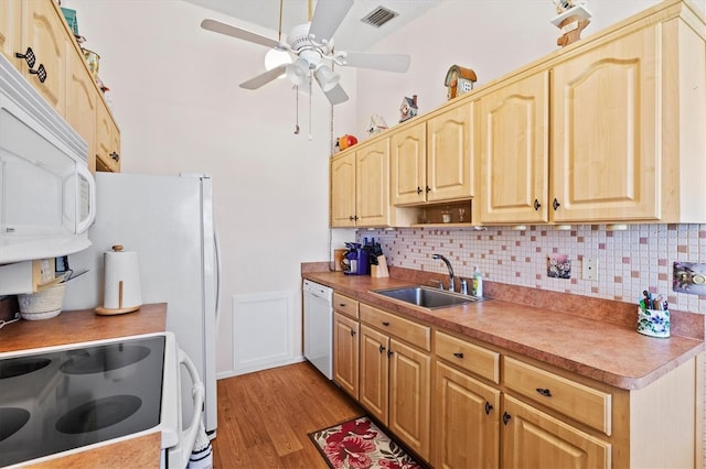 kitchen featuring sink, white appliances, ceiling fan, tasteful backsplash, and light wood-type flooring