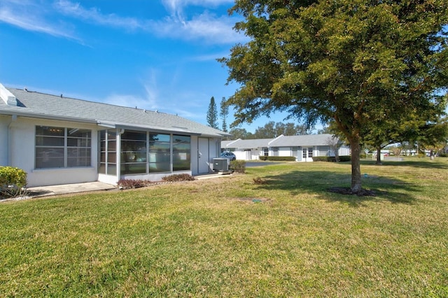 view of yard featuring a sunroom