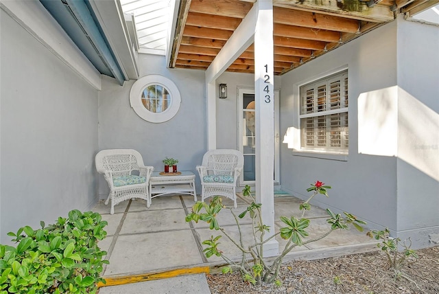 doorway to property with a patio