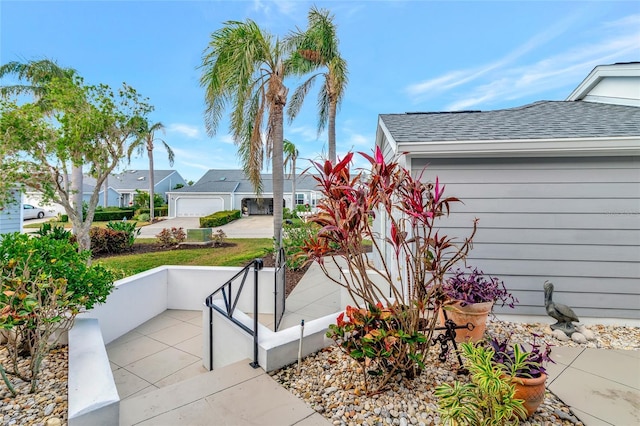 view of patio / terrace featuring a garage