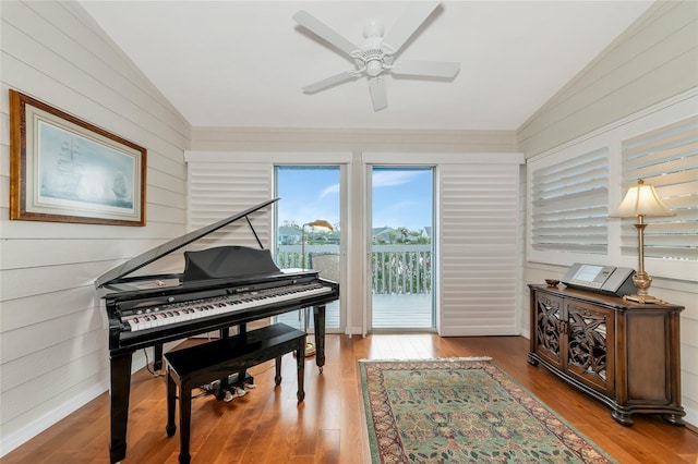 misc room with lofted ceiling, light hardwood / wood-style flooring, and ceiling fan