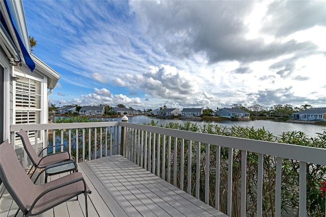 wooden deck with a water view