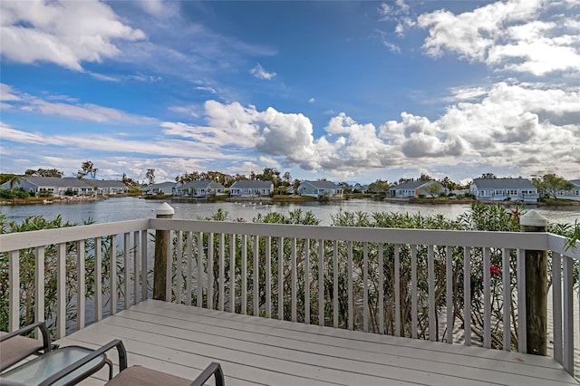 wooden deck with a water view