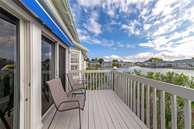 wooden terrace with a water view