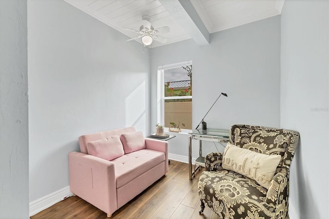 sitting room featuring ceiling fan, beam ceiling, and hardwood / wood-style floors