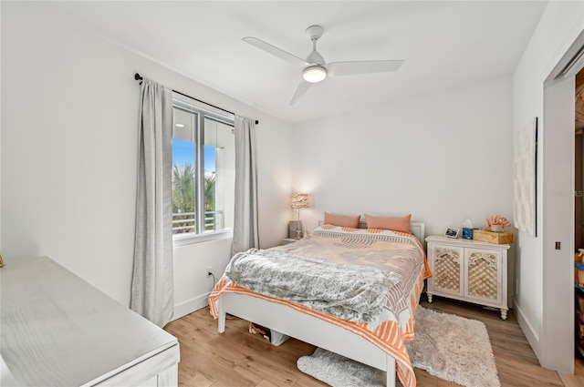 bedroom featuring light hardwood / wood-style flooring and ceiling fan