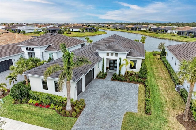 birds eye view of property with a water view