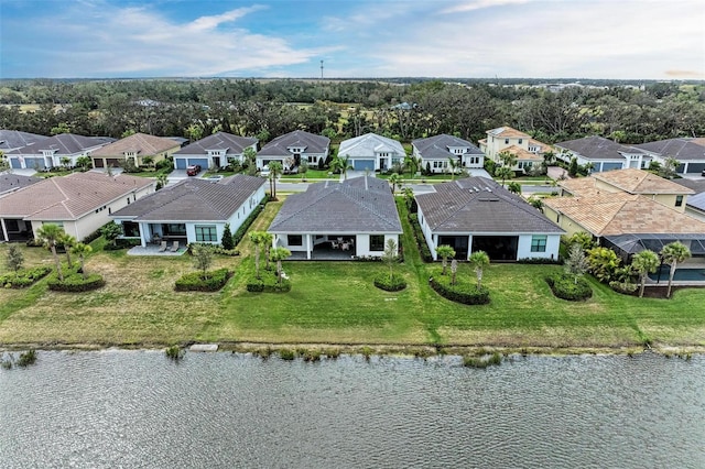 birds eye view of property featuring a residential view and a water view