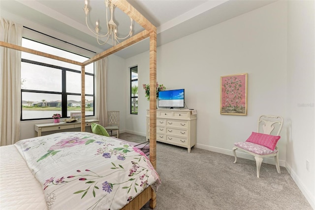 bedroom with light carpet and a chandelier