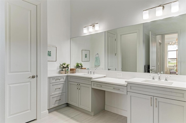 full bathroom featuring double vanity and a sink