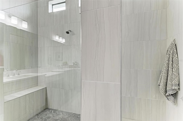 bathroom with tiled shower