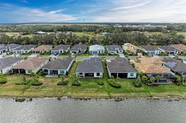 aerial view featuring a residential view and a water view