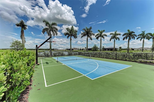 view of sport court featuring community basketball court and fence