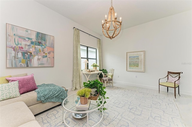 living area featuring baseboards and an inviting chandelier