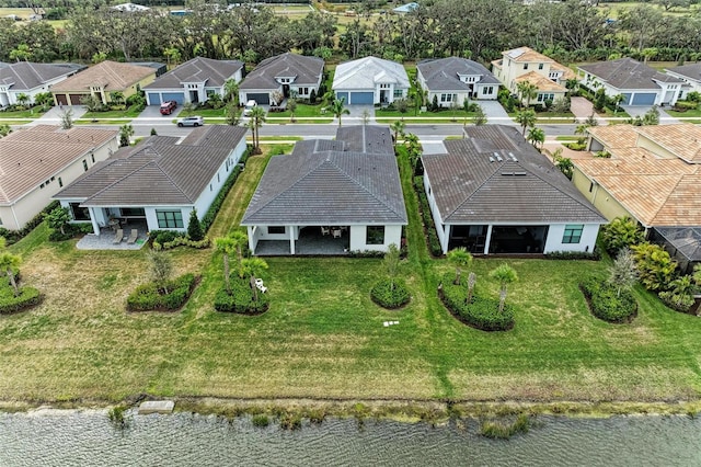 bird's eye view with a residential view and a water view