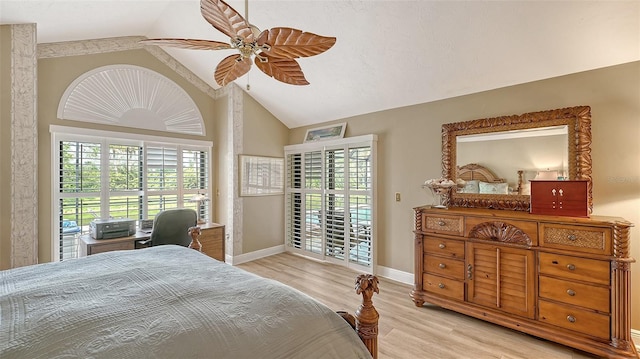 bedroom with lofted ceiling, light wood finished floors, ceiling fan, and baseboards