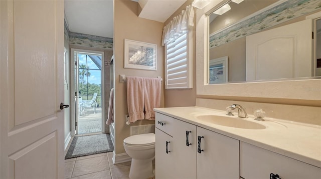 full bathroom featuring toilet, tile patterned flooring, and vanity