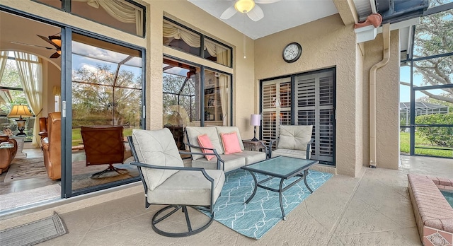 sunroom with a ceiling fan