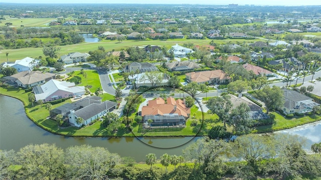 bird's eye view featuring a water view and a residential view