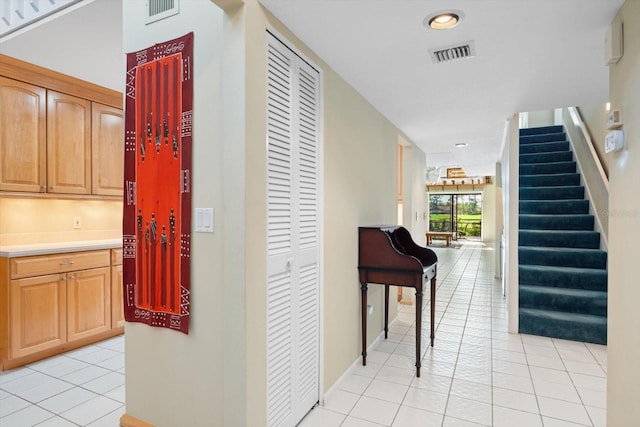 corridor with light tile patterned floors